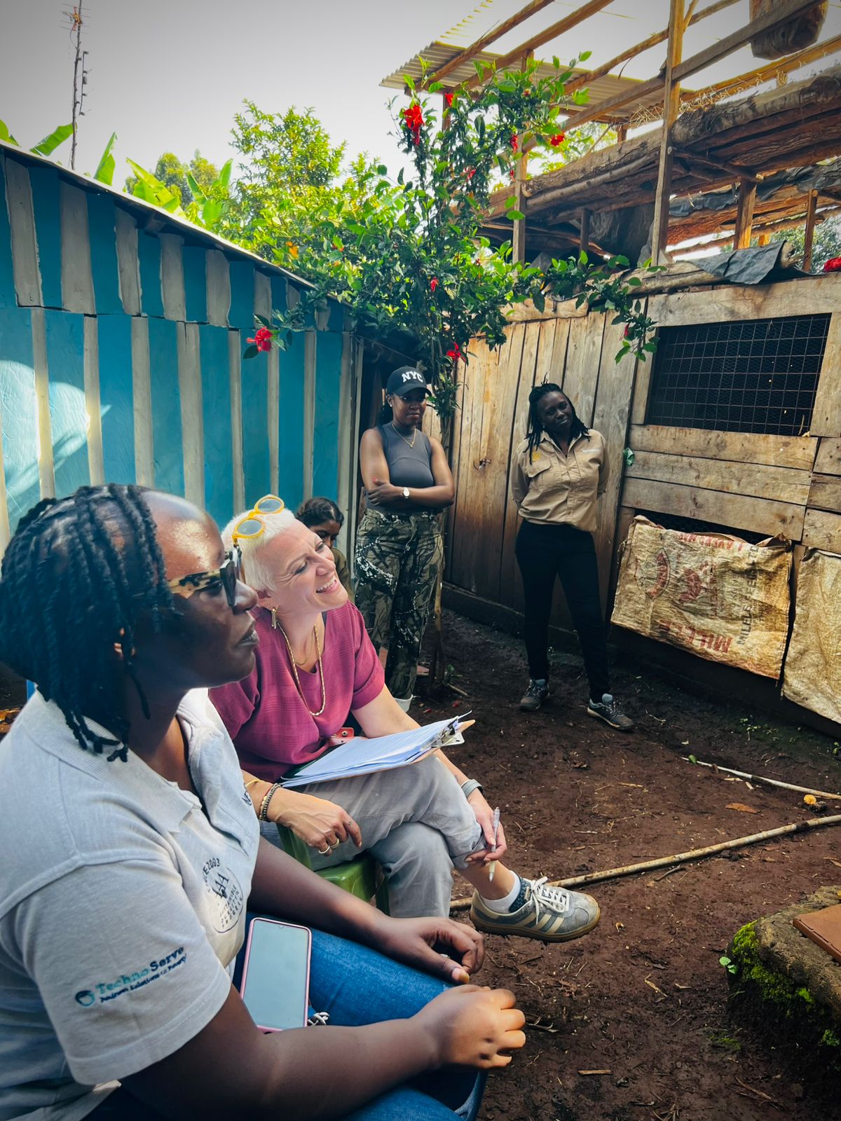 Shani in conversation with entrepreneurs during a field workshop session.